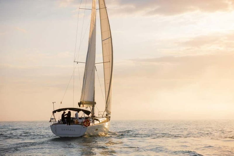 Barcelona: Luxury Sunset Sailboat Tour from Port Olimpic - Taking the helm and feeling the wind