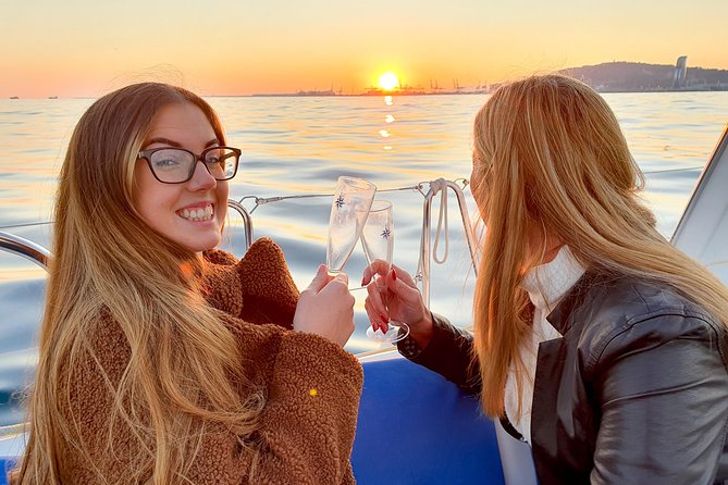 Barcelona Sunset Sailing Cruise from Port Olímpic with Open Bar - Raising the sails beyond the harbor entrance
