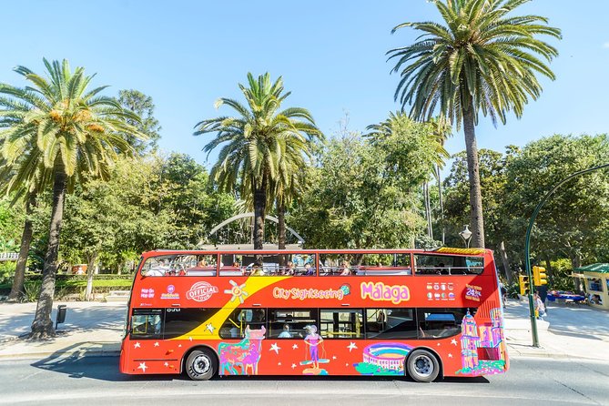 Malaga Shore Excursion: City Sightseeing Malaga Hop-On Hop-Off Bus Tour - Heat, rain, audio, and waiting times