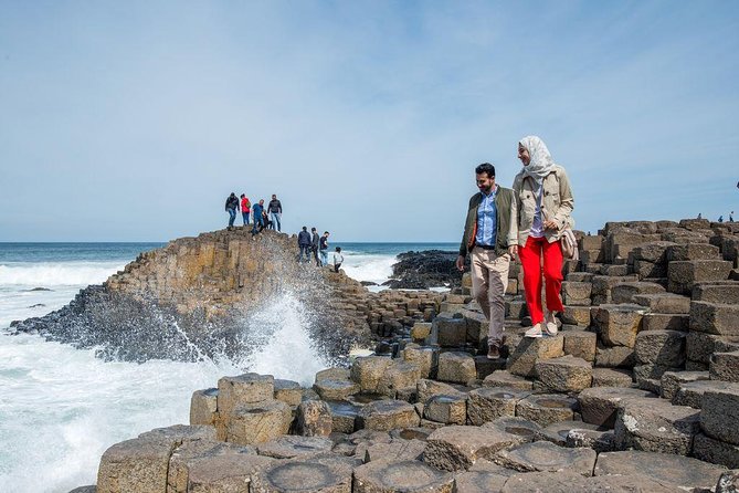 (Small Group) Shore Tour from Belfast: Giant's Causeway and Belfast Day Trip - Dunluce Castle gives the coast its dramatic picture